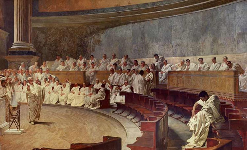 Anfang November 63 v. Chr. hält Cicero vor dem Senat eine flammende Rede gegen seinen Rivalen, den adeligen Verschwörer Catilina. Er fordert den im Rat Anwesenden auf, sich endlich als Staatsfeind zu bekennen - und Rom zu verlassen