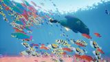 Taucherin Abzu im Ozean im Fischschwarm