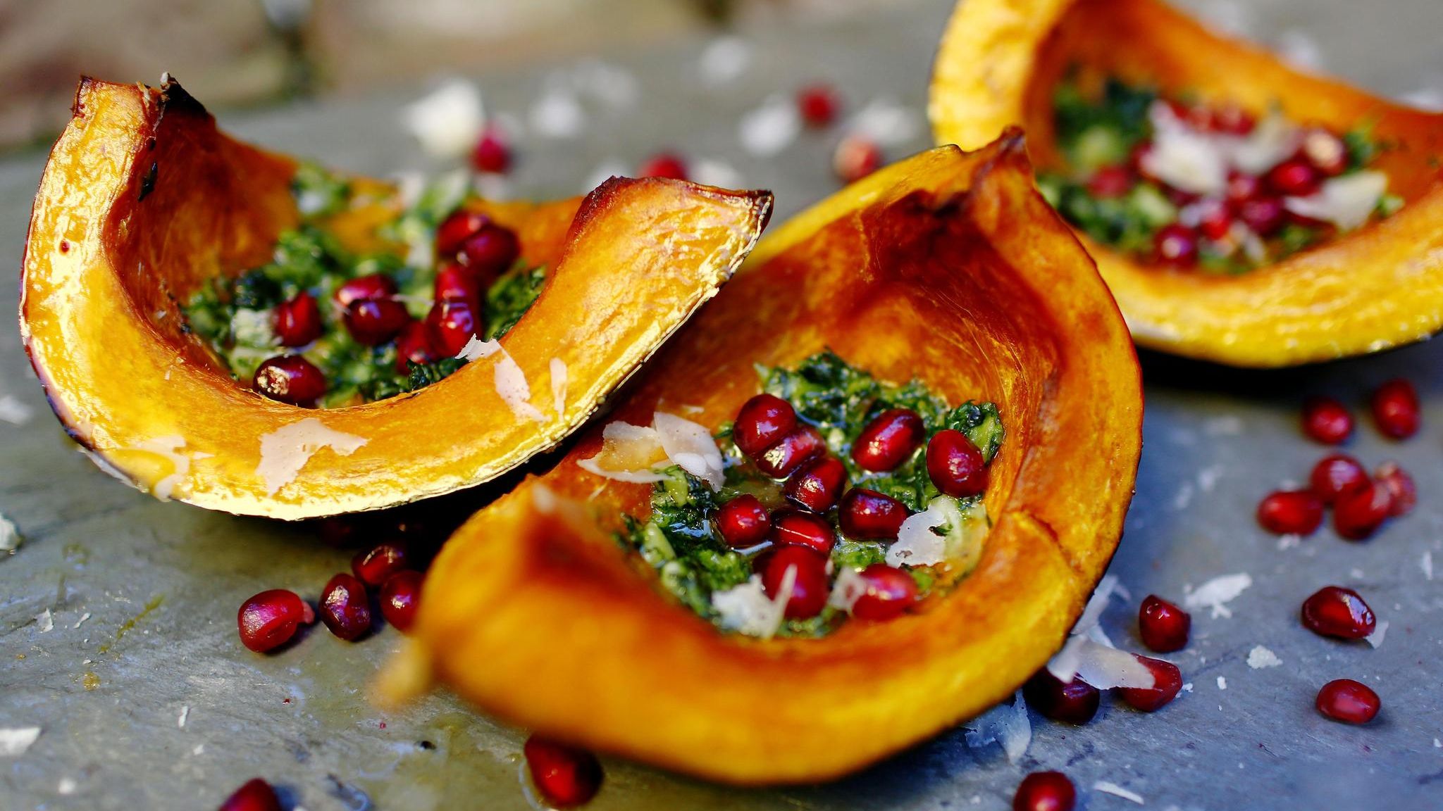 Roasted squash with pomegranate seeds and homemade pesto