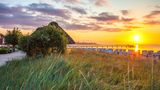 Strand von Scharbeutz bei der Seebrücke zum Sonnenuntrgang