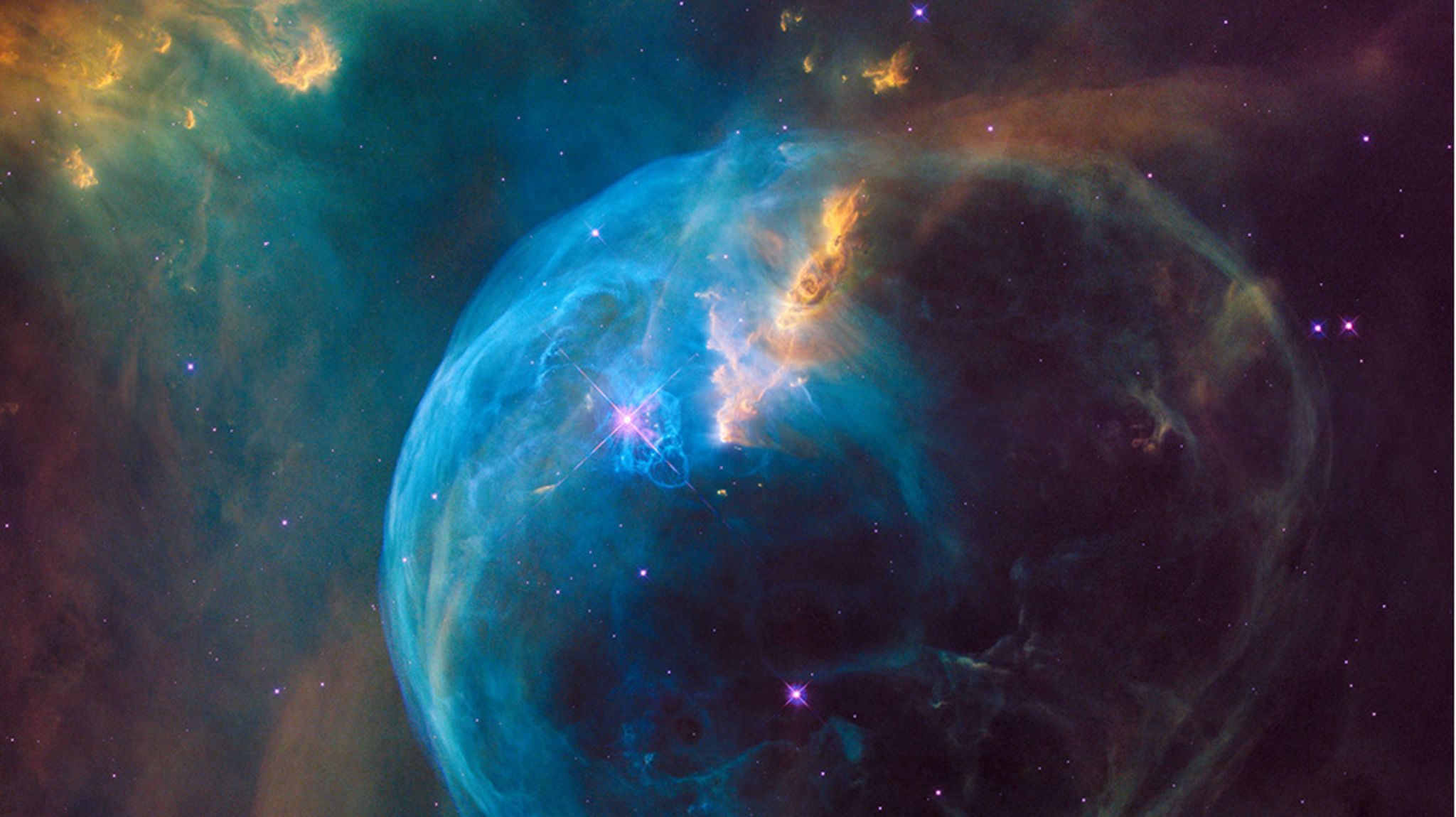 Geburt der Elemente: Kosmischer Kreislauf: Hier schleudert ein junger Stern (Mitte, etwa bei zehn Uhr, glitzernd) gewaltige Mengen an Gas (blau) ins All. Darunter auch Substanzen, die zuvor in seinem Inneren entstanden sind und nun als Rohmaterial für neue Himmelskörper dienen Kosmischer Kreislauf: Hier schleudert ein junger Stern (Mitte, etwa bei zehn Uhr, glitzernd) gewaltige Mengen an Gas (blau) ins All. Darunter auch Substanzen, die zuvor in seinem Inneren entstanden sind und nun als Rohmaterial für neue Himmelskörper dienen