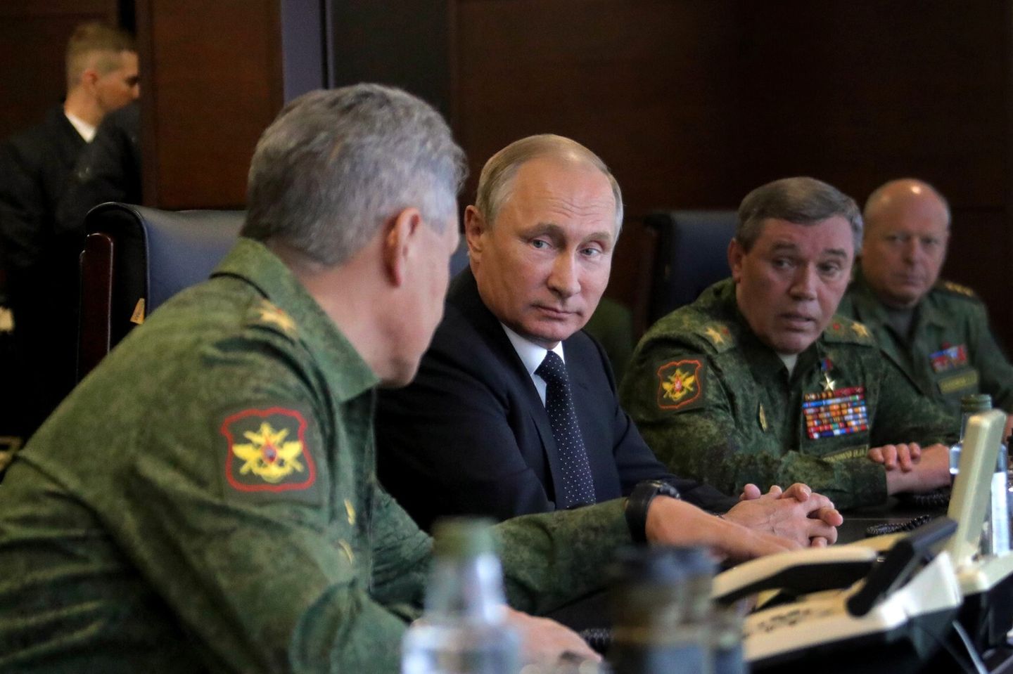 September 18, 2017 - Leningrad Region, Russia - September 18, 2017. - Russia, Leningrad Region, Luzhsky range. - Russian President Vladimir Putin seen while surveying the Russia and Belarus Union State armed forces activities at the main stage of the joint strategic exercises 'Zapad-2017'. Second right: Deputy Defense Minister General Valery Gerasimov, Chief of the Russian Armed Forces General Staff. Left: Russian Defense Minister Sergey Shoigu