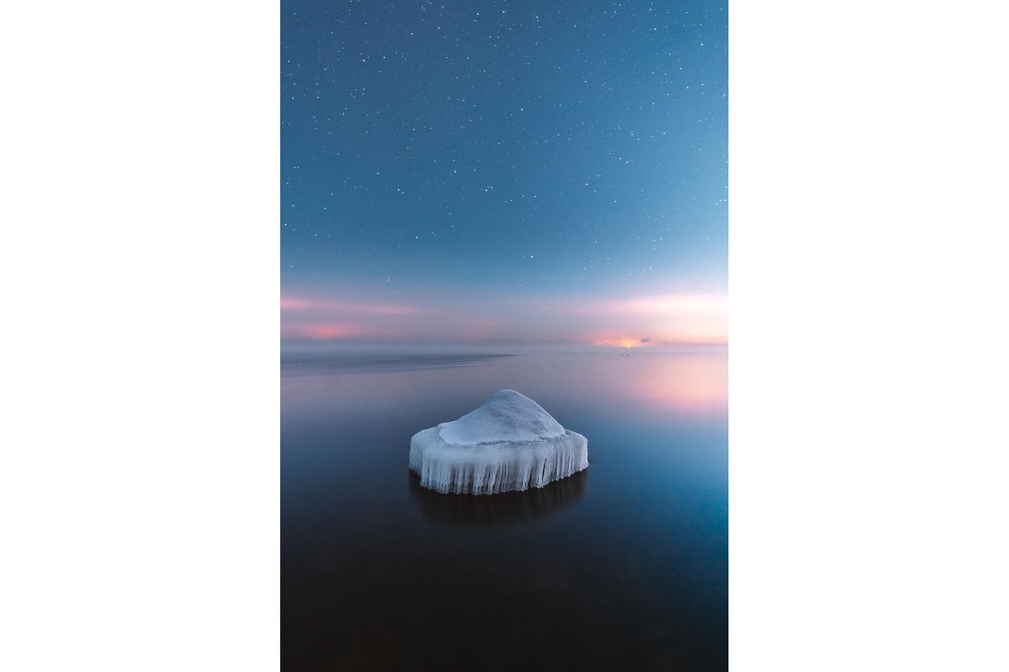 Image Name: Frozen Rock  Photographer Name: Damon Beckford  Year: 2022  Image Description: <p>In January 2021 the temperature went down to -25°C on the south coast of Finland. I went to Emäsalo in the city of Porvoo to capture the freezing of the Baltic Sea. As the sea starts to freeze, it creates beautiful ice sculptures on the rocks, and a few days later the sea is frozen. The picture was shot at night with a slow shutter speed on extremely slippery ice.</p>  Copyright: © Damon Beckford, Finland, Winner, National Awards, Landscape, 2022 Sony World Photography Awards