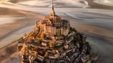Image Name: Le Mont.Saint-Michel at Sunset  Photographer Name: Cigdem Ayyildiz  Year: 2022  Image Description: <p>For me, this piece of art on the shores of Normandy is a candidate for Eighth Wonder of the World; providing a legendary view and atmosphere especially at sunset and when the tide is low.</p>  Copyright: © Cigdem Ayyildiz, Turkey, Winner, National Awards, Landscape, 2022 Sony World Photography Awards