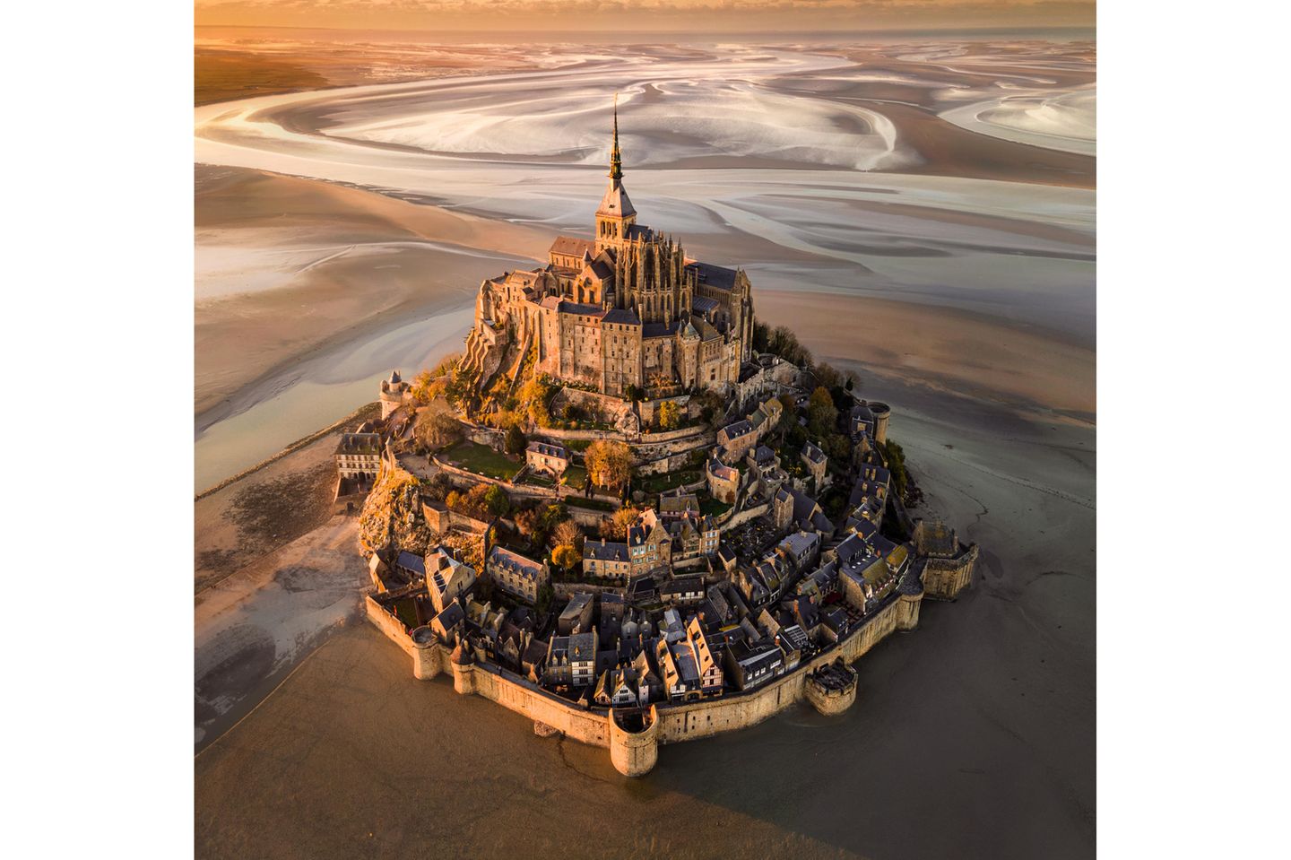 Image Name: Le Mont.Saint-Michel at Sunset  Photographer Name: Cigdem Ayyildiz  Year: 2022  Image Description: <p>For me, this piece of art on the shores of Normandy is a candidate for Eighth Wonder of the World; providing a legendary view and atmosphere especially at sunset and when the tide is low.</p>  Copyright: © Cigdem Ayyildiz, Turkey, Winner, National Awards, Landscape, 2022 Sony World Photography Awards