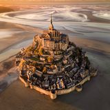 Image Name: Le Mont.Saint-Michel at Sunset  Photographer Name: Cigdem Ayyildiz  Year: 2022  Image Description: <p>For me, this piece of art on the shores of Normandy is a candidate for Eighth Wonder of the World; providing a legendary view and atmosphere especially at sunset and when the tide is low.</p>  Copyright: © Cigdem Ayyildiz, Turkey, Winner, National Awards, Landscape, 2022 Sony World Photography Awards