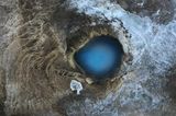 Image Name: Earth's Eye  Photographer Name: Mathis Vandermeeren  Year: 2022  Image Description: <p>This picture was taken with my drone in a geothermal area called Hverravellir in the centre of Iceland, in August 2021. It shows a natural hot spring that has a wonderful blue colour, especially when seen from above.</p>  Copyright: © Mathis Vandermeeren, Belgium, Winner, National Awards, Landscape, 2022 Sony World Photography Awards