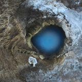 Image Name: Earth's Eye  Photographer Name: Mathis Vandermeeren  Year: 2022  Image Description: <p>This picture was taken with my drone in a geothermal area called Hverravellir in the centre of Iceland, in August 2021. It shows a natural hot spring that has a wonderful blue colour, especially when seen from above.</p>  Copyright: © Mathis Vandermeeren, Belgium, Winner, National Awards, Landscape, 2022 Sony World Photography Awards