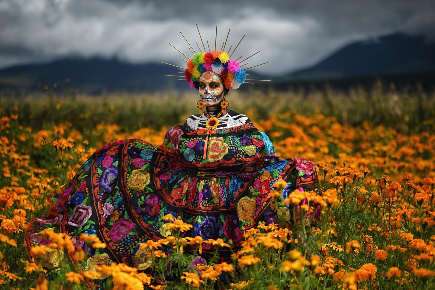 Image Name: The Scent of Cempasúchil  Photographer Name: Sergio Carrasco  Year: 2022  Image Description: <p>Mexican Catrina, an icon of the Day of the Dead, wearing a typical Mexican dress from the state of Chiapas. She is standing in a field of Mexican marigold, or Cempasúchil, a flower traditionally used for Mexican Day of the Dead celebrations. Every year, my wife puts on a different Catrina costume to celebrate our tradition.</p>  Copyright: © Sergio Carrasco, Mexico, Shortlist, National Awards, Portraiture, 2022 Sony World Photography Awards