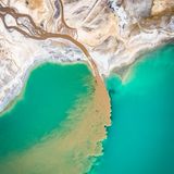 Image Name: Turquoise Lake  Photographer Name: Marcin Giba  Year: 2022  Image Description: <p>I took this photo of a turquoise lake in Poland with a drone in Autumn 2021. Let us not be deceived by the blue colour of the water, or the colour of the sand. It is the result of human activity interfering with the natural environment. You cannot bathe in this lake, and the water is poisonous.</p>  Copyright: © Marcin Giba, Poland, Winner, National Awards, Landscape, 2022 Sony World Photography Awards