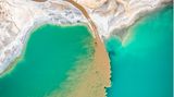 Image Name: Turquoise Lake  Photographer Name: Marcin Giba  Year: 2022  Image Description: <p>I took this photo of a turquoise lake in Poland with a drone in Autumn 2021. Let us not be deceived by the blue colour of the water, or the colour of the sand. It is the result of human activity interfering with the natural environment. You cannot bathe in this lake, and the water is poisonous.</p>  Copyright: © Marcin Giba, Poland, Winner, National Awards, Landscape, 2022 Sony World Photography Awards