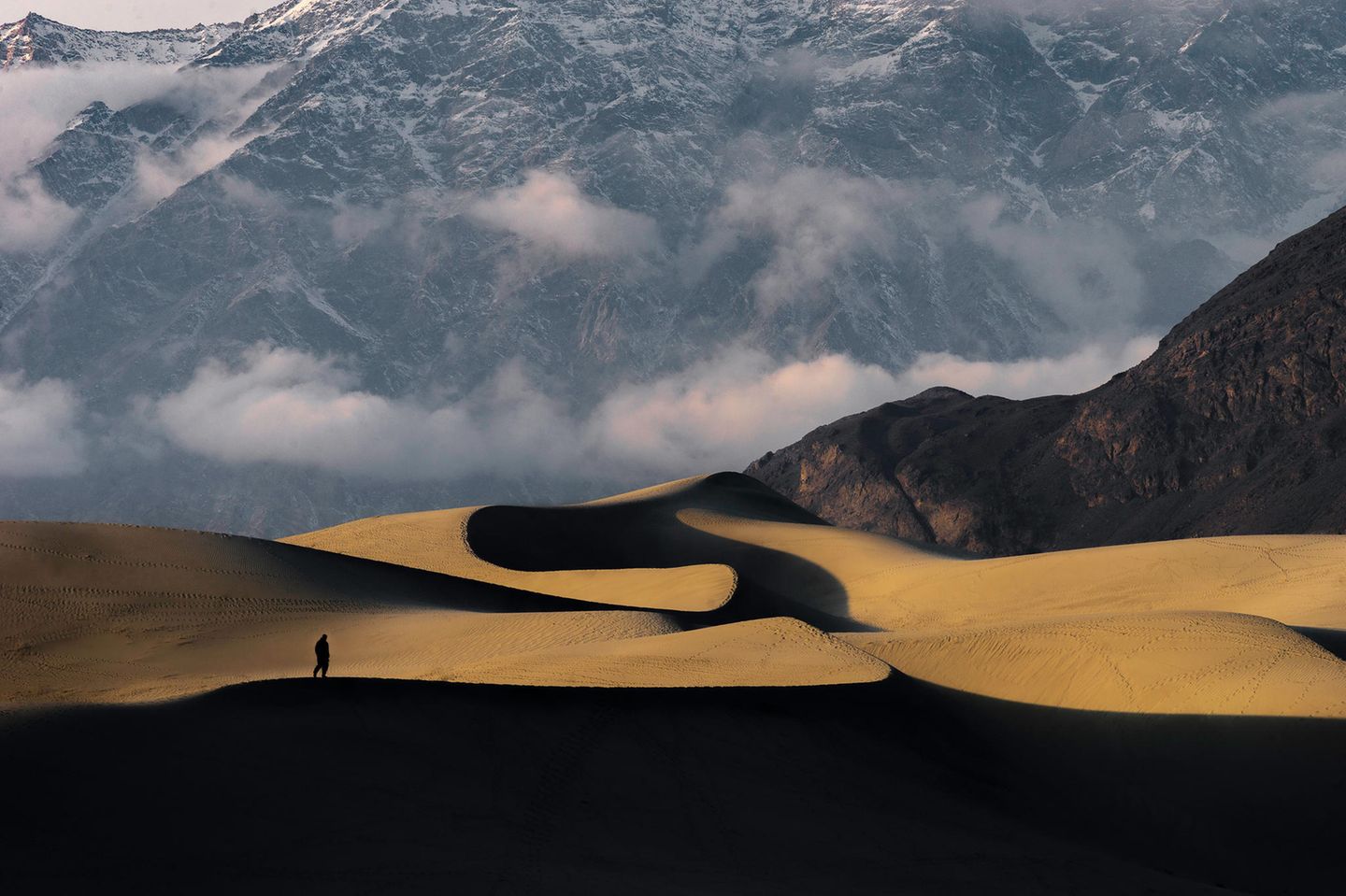 Image Name: Golden Snake  Photographer Name: Yawar Abbas  Year: 2022  Image Description: <p>In the light from this spectacular sunset the cold desert at Skardu looks like a Golden Snake.</p>  Copyright: © Yawar Abbas, Pakistan, Winner, National Awards, Travel, 2022 Sony World Photography Awards