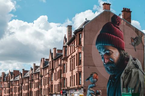 Mural depicting a modern day St. Mungo, on High Street in Glasgow.