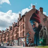 Mural depicting a modern day St. Mungo, on High Street in Glasgow.