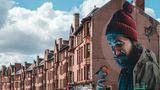 Mural depicting a modern day St. Mungo, on High Street in Glasgow.
