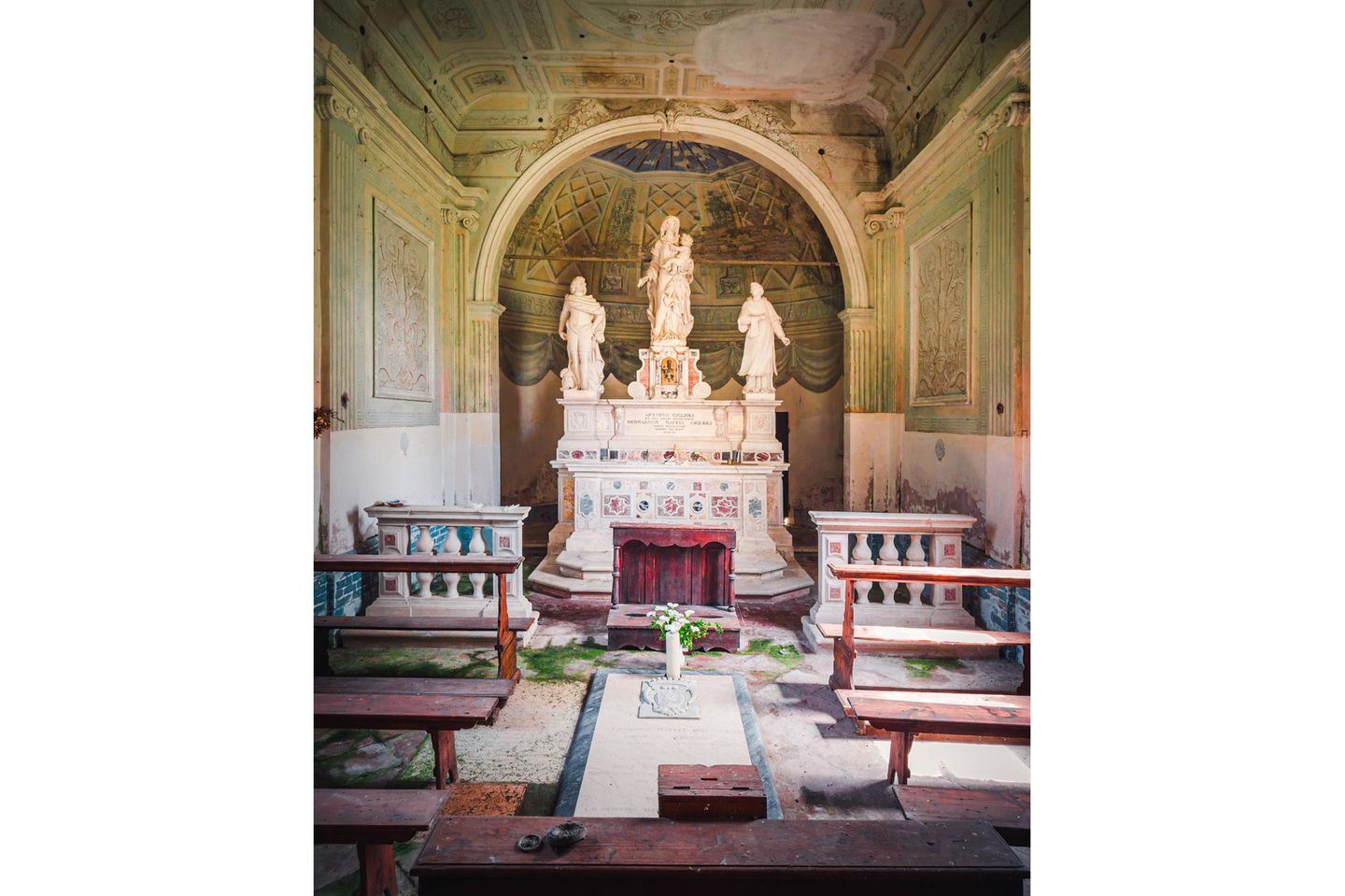 Photo 7: In this picture you see an old and beautiful little chapel with a grave inside, located in Northern Italy. The chapel was surrounded by abandoned buildings that were mostly destroyed. It's a tiny building, compared to the rest of the buildings on site.