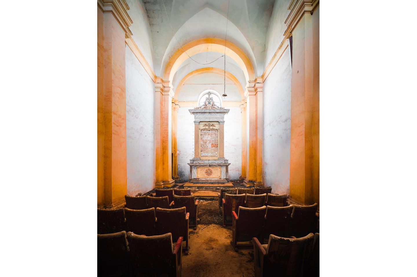 Photo 3: Photographed this chapel in the Puglia region. The chapel is part of an abandoned farm house, that’s located along a quiet dirt road. The seats in the church remind me of a cinema.