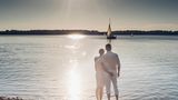 Couple standing at Lake Cospuden in the evening, Sachsen