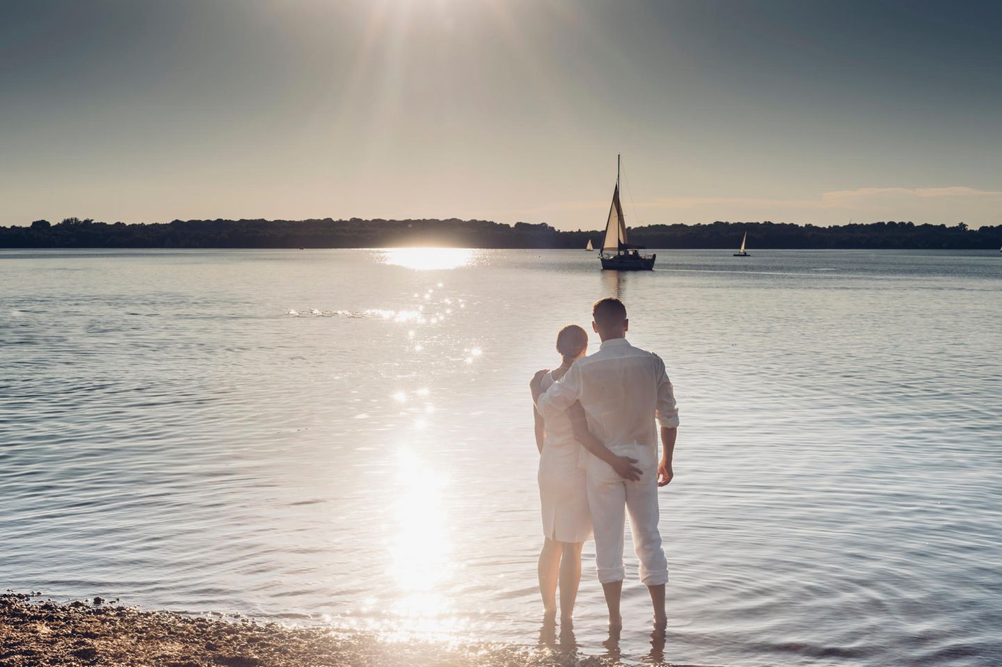 Cospudener See, Sachsen Couple standing at Lake Cospuden in the evening, Sachsen