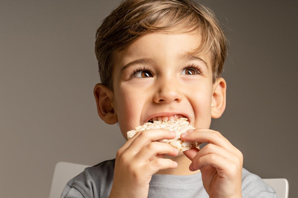 A child eats a rice cake
