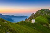 Val Grande, Piedmont, Italy. Landscape with mountain hut at sunrise.