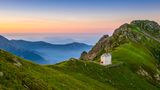 Val Grande, Piedmont, Italy. Landscape with mountain hut at sunrise.