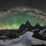 GOLD: JAKE MOSHER, USA  On June 17th, 2021, I hiked, snowshoed, and climbed to the 11,000-foot summit of Wyoming's Table Mountain to photograph the Milky Way over Grand Teton Peak. While these iconic mountains have been photographed tens of thousands of times, I wanted to show an entirely unique view of them. I was treated to one of the most spectacular displays of airglow that I've ever seen - similar to the aurora and created by photo-charged particles, but spanning much of the horizon.