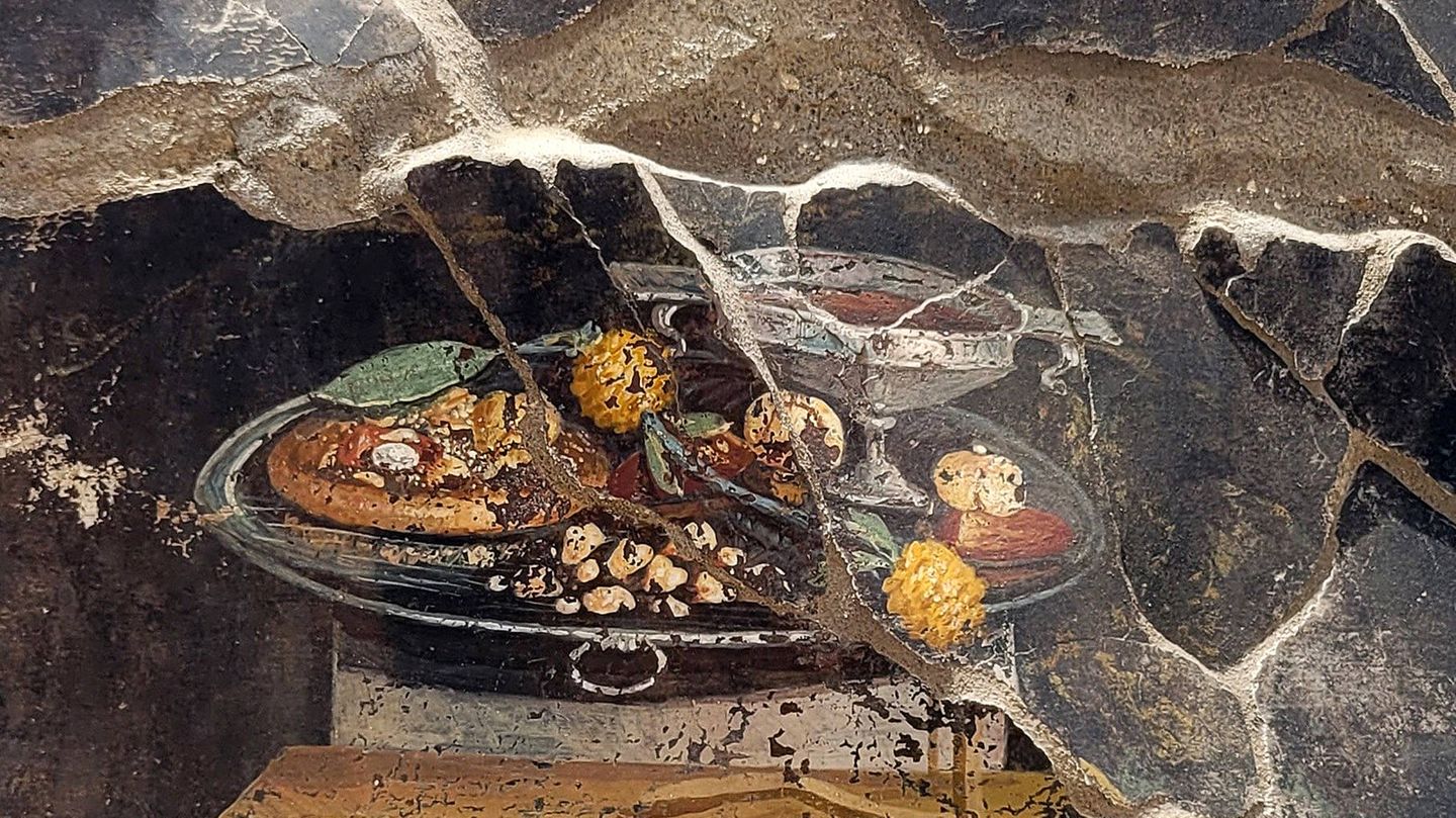 Das nun in Pompeji freigelegte Fresko zeigt einen appetitlichen Teigfladen, wenn auch noch ohne die klassischen Tomaten und Mozzarella