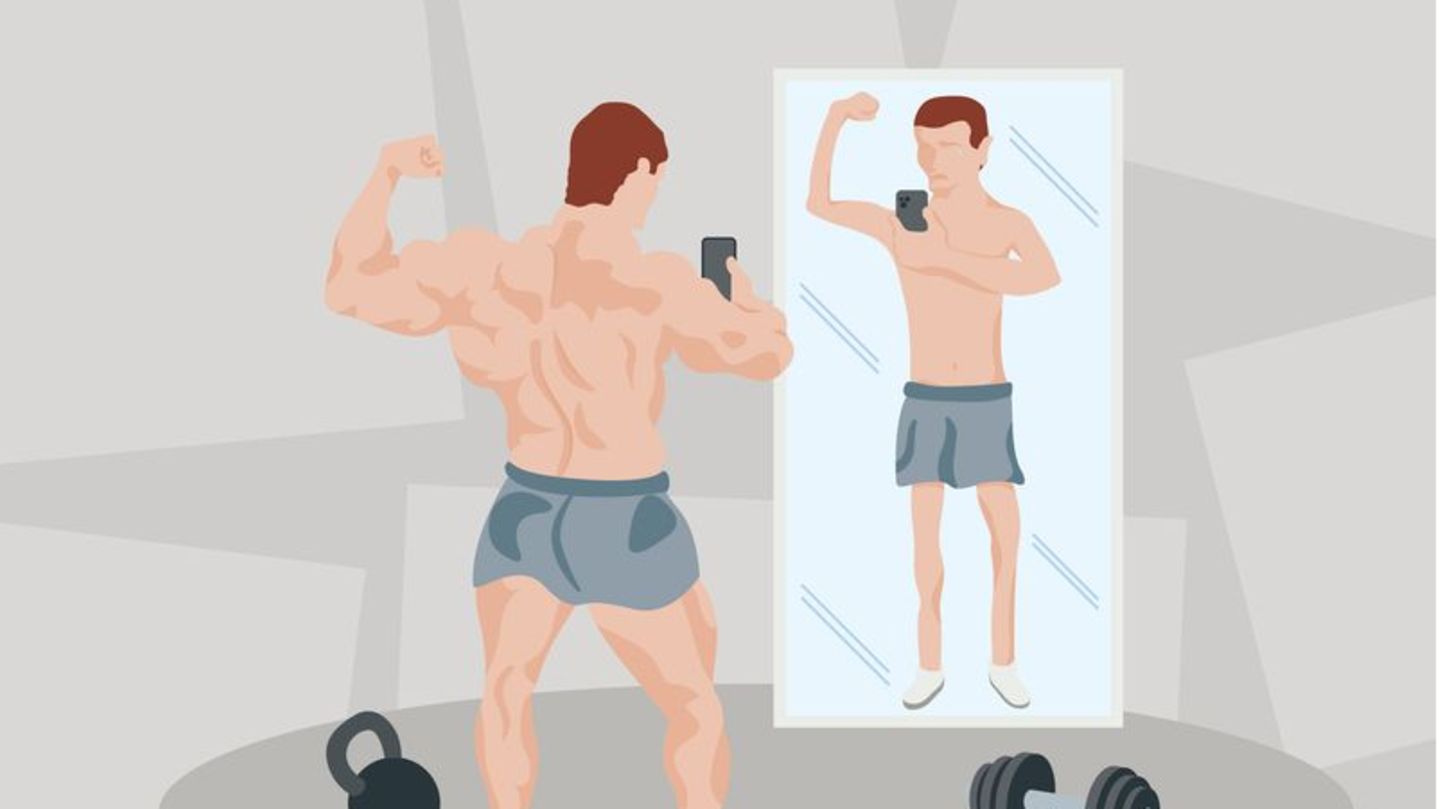 Ein Sportler steht vor einem Spiegel