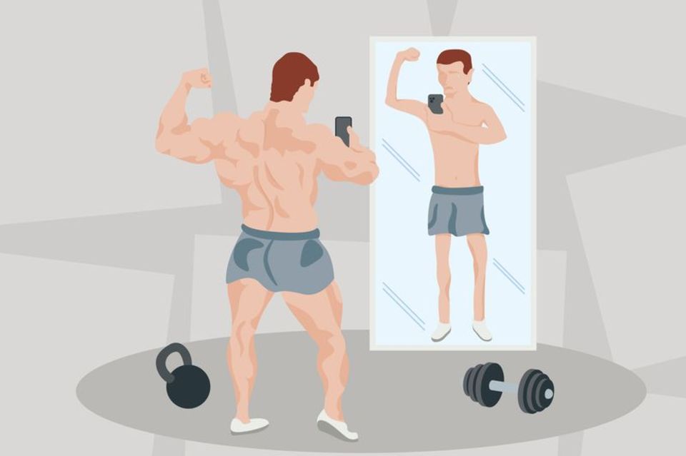 Ein Sportler steht vor einem Spiegel