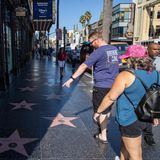 LOS ANGELES, CA - SEPTEMBER 3: Tourists are seen on Hollywood Walk of Fame despite extreme heat in Los Angeles, California, United States on September 3, 2022. Tayfun Coskun / Anadolu Agency