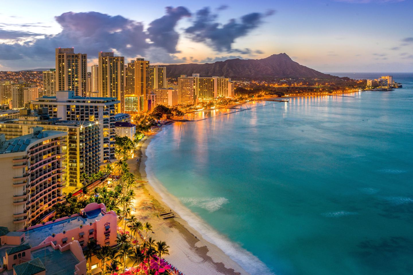 An aerial view of Waikiki Beach, Oahu, Hawaii at night