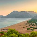 Beautiful sunset view of the Cirali Olympos beach at Mediterranean sea, Antalya, Turkey