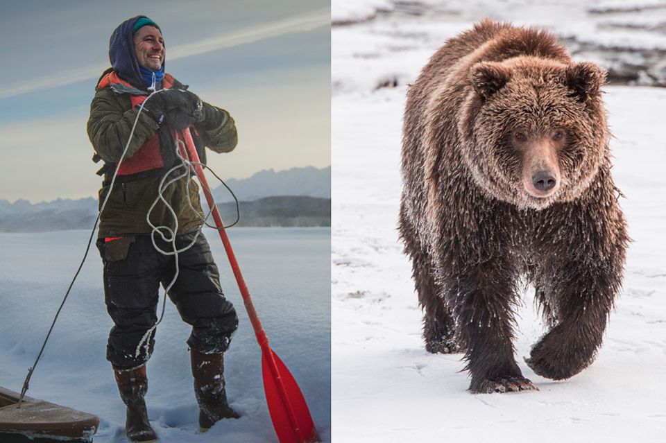 Mann mit Paddel im Schnne, gegenüber ein Braunbär  1.5016