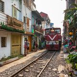 View of Hanoi train street between Le Duan and Kham Thin Street in Hanoi old quarter, Hanoi, Vietnam, Asia with a train travelling from Hanoi station