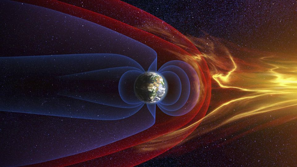 Eine Grafik zeigt die Erde und ihr Magnetfeld sowie Sonnenstrahlen, die darauftreffen