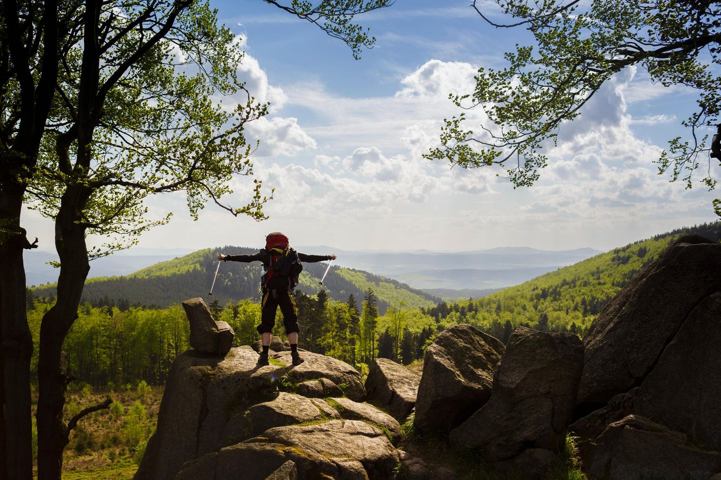 Hiker standing on the viewpoint Gloeckner along the hiking trail Rennsteig in the Thuringian Forest on May 05, 2015 in Ruhla, Germany