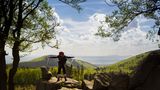 Hiker standing on the viewpoint Gloeckner along the hiking trail Rennsteig in the Thuringian Forest on May 05, 2015 in Ruhla, Germany