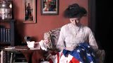 Frau stickt eine amerikanische Flagge