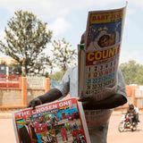 Straßenhändler verkauft Plakat