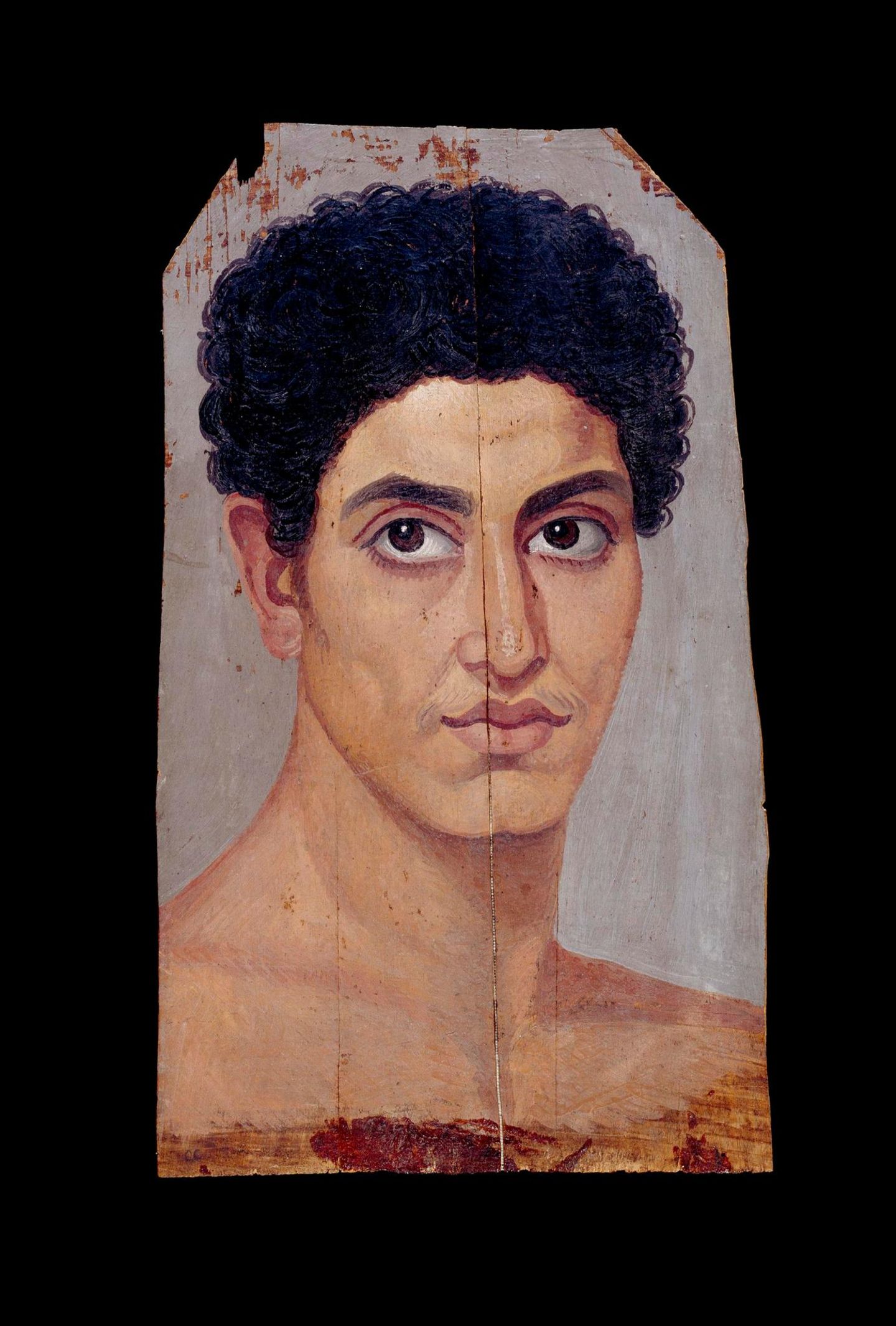 Porträt eines jungen, lockenköpfigen Mannes mit großen braunen Augen und nacktem Oberkörper