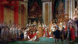Es war ein unerhörter Akt: Am 2. Dezember 1804 setzte sich Napoleon am Altar von Notre-Dame eine goldene Lorbeerkrone auf den Kopf – und krönte sich damit selbst zum Kaiser der Franzosen. Und gleich darauf seine Frau Josephine zur Kaiserin. Er zeigte allen Beobachtern: Der Herrscher verdankt die Kaiserwürde nicht seinen Vorfahren, sondern allein der eigenen Macht. Papst Pius VII., der Napoleon gesalbt hatte, erfuhr unterdessen eine erniedrigende Behandlung 