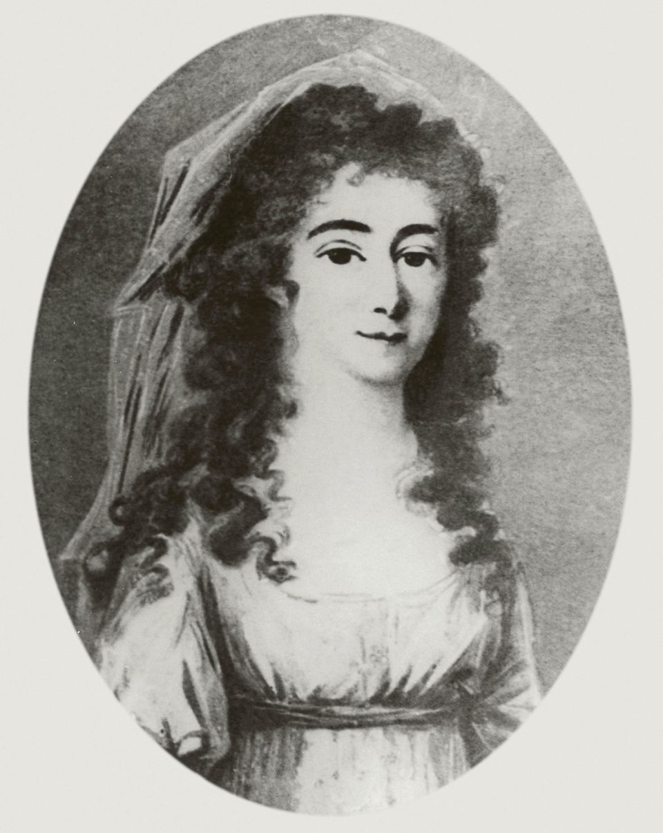 Schwarz-weiß gehaltenes Brustporträt von Henriette Vogel mit langen dunklen Locken, die locker von einem Tuch bedeckt werden