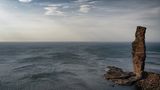 Felsnase im Meer, dramatische Stimmung
