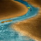 Chinesischer Fischer am Strand