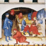 Mann probiert Gewand bei Händler an