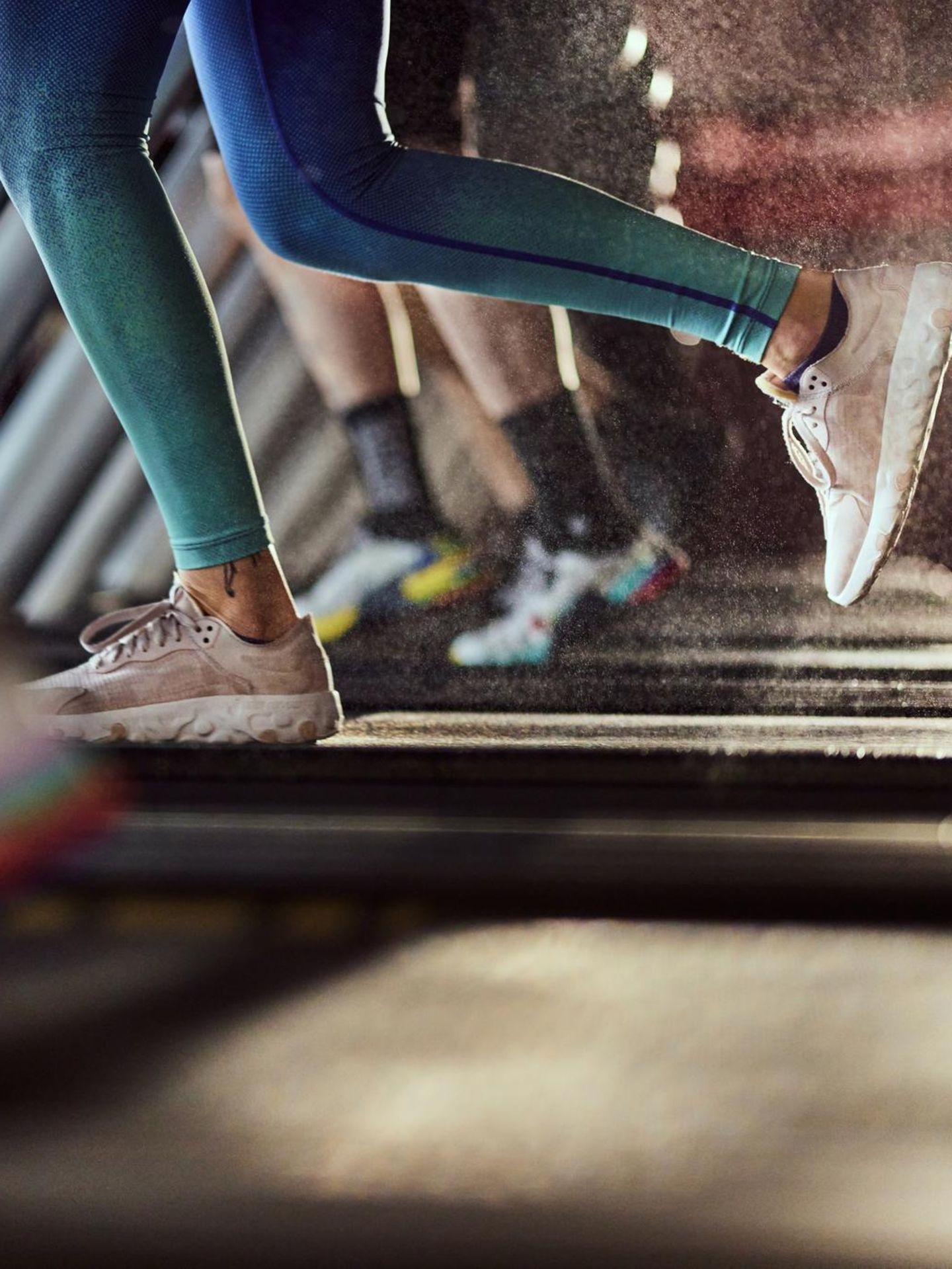 Unrecognizable athletic woman exercising on treadmill in a health club.
