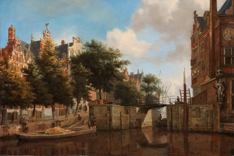 Herengracht, wo ein Kahn gerade eine Schleuse passiert