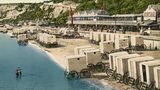Am Strand vor dem Kursaal im Seebad Sandown sorgen überdachte Wagen dafür, dass Badegäste ungestört und sittsam ihre Badekleidung anziehen und im Meer baden gehen können. 