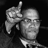 Malcolm X gestikuliert mit Hand